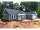New construction featuring gray siding and white trim, with a two-car garage at 415 Dogwood Ln, Statesville, NC 28625