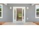 Elegant front door featuring sidelights and white trim at 415 Dogwood Ln, Statesville, NC 28625