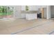View of the open concept kitchen with white cabinets and a kitchen island at 415 Dogwood Ln, Statesville, NC 28625