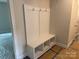 Well-organized mudroom with built-in bench, hooks, and cubbies for storage and convenience at 415 Dogwood Ln, Statesville, NC 28625