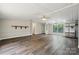 Inviting living room with updated flooring, neutral walls, and large windows offering plenty of light at 5001 Grand Canyon Nw Rd, Concord, NC 28027