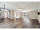 Bright living room featuring modern floors, fresh paint, and ample natural light from windows at 5001 Grand Canyon Nw Rd, Concord, NC 28027