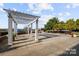 Inviting outdoor patio with pergola, string lights, and ample seating for relaxation and gatherings at 5001 Grand Canyon Nw Rd, Concord, NC 28027