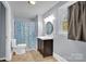 Bright bathroom with a shower, toilet, and modern vanity at 510 Wiley Ave, Salisbury, NC 28144