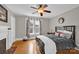 Cozy bedroom features hardwood floors, a comfortable bed, and soft natural light at 510 Wiley Ave, Salisbury, NC 28144