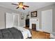 This bedroom features hardwood floors, a decorative fireplace, and neutral wall paint at 510 Wiley Ave, Salisbury, NC 28144