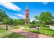 Beautiful brick bell tower with benches and brick path in a landscaped park setting under a blue sky at 510 Wiley Ave, Salisbury, NC 28144
