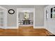 Open-concept dining room with hardwood floors, a chandelier, and seating for six at 510 Wiley Ave, Salisbury, NC 28144