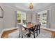 Light and airy dining room with hardwood floors, bright windows and a decorative chandelier at 510 Wiley Ave, Salisbury, NC 28144