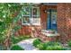 Welcoming brick entryway with a stone walkway, decorative plants, and a stylish front door at 510 Wiley Ave, Salisbury, NC 28144