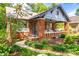 Inviting brick porch with comfortable seating, a ceiling fan, and a charming garden path at 510 Wiley Ave, Salisbury, NC 28144