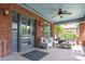 Cozy front porch with stylish seating, a ceiling fan, and double glass paneled entry doors at 510 Wiley Ave, Salisbury, NC 28144