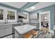 Bright kitchen features stainless appliances, white countertops and stylish cabinets with backyard views at 510 Wiley Ave, Salisbury, NC 28144
