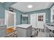 Kitchen featuring gray cabinets, stainless appliances, and an island with white countertop at 510 Wiley Ave, Salisbury, NC 28144