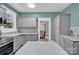 Stylish kitchen with modern finishes, stainless steel appliances, and a view into the dining area at 510 Wiley Ave, Salisbury, NC 28144