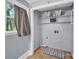 Laundry room with washer/dryer hookups, storage shelves, and a window at 510 Wiley Ave, Salisbury, NC 28144