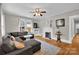 Inviting living room with hardwood floors, fireplace, and large sectional sofa at 510 Wiley Ave, Salisbury, NC 28144