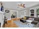 Cozy living room featuring hardwood floors, a large sectional sofa and an open view to the dining room at 510 Wiley Ave, Salisbury, NC 28144