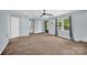 Spacious living room with carpet, natural light, and several doors at 510 Wiley Ave, Salisbury, NC 28144