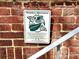 Image of a Monarch Waystation sign on a brick wall at 510 Wiley Ave, Salisbury, NC 28144