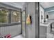 View of a screened porch from the exterior, with a partial view into the kitchen at 510 Wiley Ave, Salisbury, NC 28144
