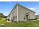 Back of a two-story home featuring a patio and green yard at 5207 Maynard Hill Dr, Monroe, NC 28110