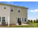 View of a backyard with patio, sliding glass doors, air conditioning unit, well-maintained lawn, and green grass at 5207 Maynard Hill Dr, Monroe, NC 28110