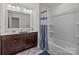 Beautiful bathroom featuring a modern double vanity and a shower tub combination at 5207 Maynard Hill Dr, Monroe, NC 28110