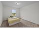 Simple bedroom with cozy bed and backyard view at 5207 Maynard Hill Dr, Monroe, NC 28110