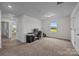 Spacious bedroom with neutral carpet, white walls, ample natural light, and view to additional room at 5207 Maynard Hill Dr, Monroe, NC 28110