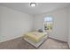 Simple bedroom with cozy bed and view of neighborhood at 5207 Maynard Hill Dr, Monroe, NC 28110