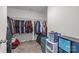 Walk-in closet with carpet flooring, shelving, rod for hanging clothes and space for storage at 5207 Maynard Hill Dr, Monroe, NC 28110