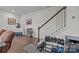 Hallway area featuring staircase, shoe rack, and view into adjoining living area at 5207 Maynard Hill Dr, Monroe, NC 28110