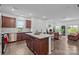 Open floor plan with kitchen island and view into an inviting living area at 5207 Maynard Hill Dr, Monroe, NC 28110
