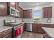 Well-equipped kitchen featuring stainless steel appliances, granite countertops, and modern cabinetry at 5207 Maynard Hill Dr, Monroe, NC 28110
