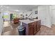 Open floor plan with kitchen island and view into an inviting living area at 5207 Maynard Hill Dr, Monroe, NC 28110