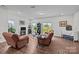 Bright living room with wood floors and sliding glass doors to the backyard at 5207 Maynard Hill Dr, Monroe, NC 28110