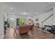 Bright living room boasts hardwood floors, natural light and an open concept layout, perfect for entertaining guests at 5207 Maynard Hill Dr, Monroe, NC 28110
