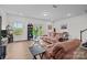 Comfortable living area with ample seating, wood-style flooring, and natural light at 5207 Maynard Hill Dr, Monroe, NC 28110