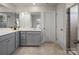 Well-lit bathroom with a double vanity, white countertops, and tile flooring at 5581 Soft Shell Dr, Lancaster, SC 29720