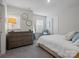 Bright bedroom featuring a plush bed, dresser, and sitting area with natural light at 5581 Soft Shell Dr, Lancaster, SC 29720