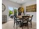 Dining area featuring a round table and chairs with a view to the outdoor living area at 5581 Soft Shell Dr, Lancaster, SC 29720