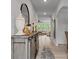 Bright hallway featuring modern decor, light wood floors, and archways at 5581 Soft Shell Dr, Lancaster, SC 29720