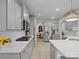 Beautiful kitchen with gray cabinets, stainless steel appliances, and a view into the dining room at 5581 Soft Shell Dr, Lancaster, SC 29720