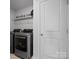 Laundry room with a modern washer and dryer set and ample storage space at 5581 Soft Shell Dr, Lancaster, SC 29720