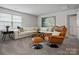 Cozy living room with a large sectional sofa, leather chair, and stylish decor at 5581 Soft Shell Dr, Lancaster, SC 29720