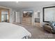 Open bedroom with a TV, dresser and a view of the bathroom at 5581 Soft Shell Dr, Lancaster, SC 29720
