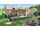 Backyard with flowers and a black metal fence at 6010 Albiza Dr, Harrisburg, NC 28075