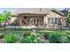 Backyard with a covered patio, barbecue, and black metal fence at 6010 Albiza Dr, Harrisburg, NC 28075