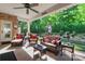 Outdoor patio featuring wicker furniture, ceiling fan, and view of the backyard at 6010 Albiza Dr, Harrisburg, NC 28075